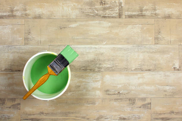 istock Paintbrush on a pot of green paint 641543402