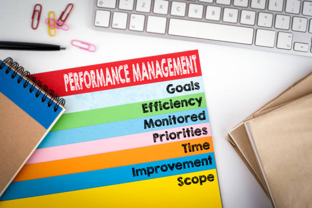 istock Performance Management. Office desk with a computer keyboard and color pages 641545288