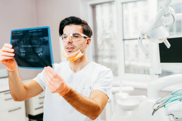 istock Dentist looking at an x-ray 641545824