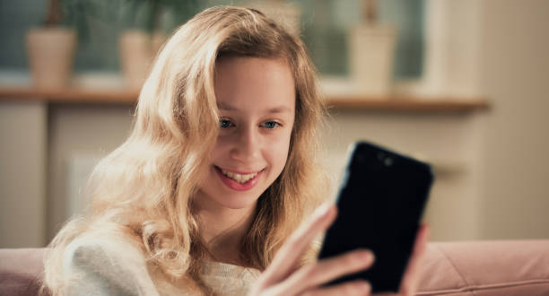 istock Teenager taking photo using smartphone camera 641548338