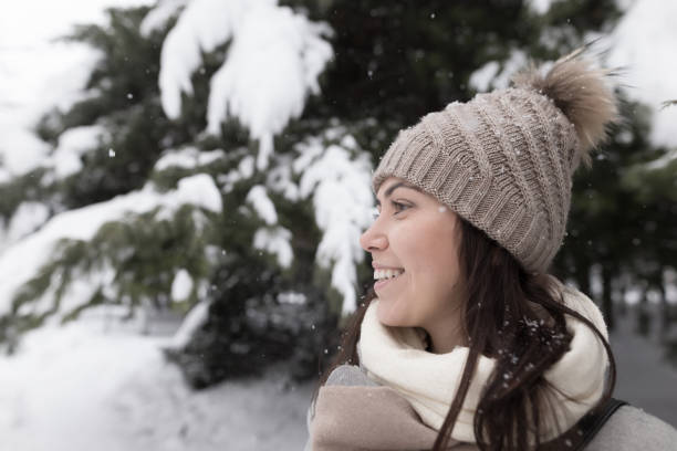 istock Smiley woman in winter nature 641550412