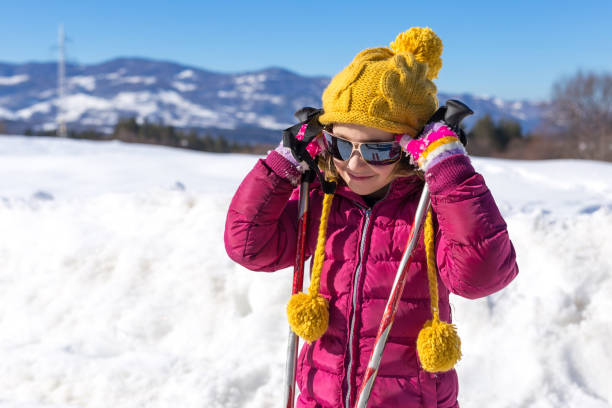 istock Cute winter girl with sunglasses 641550706