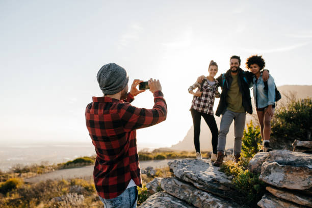 istock Group of people on hiking taking photographs 641553182