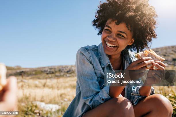 Happy Young Woman Taking Break During Country Hike Stock Photo - Download Image Now