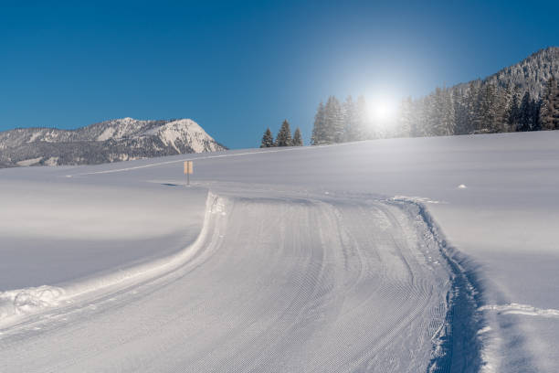 istock Beautiful sunset above the snowy road 641554244