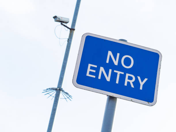 istock No Entry sign with blurred CCTV camera in background. 641555342
