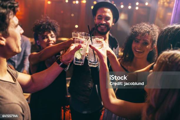 Friends Having Drinks At The Night Club Party Stock Photo - Download Image Now - Friendship, Bar - Drink Establishment, Entertainment Club