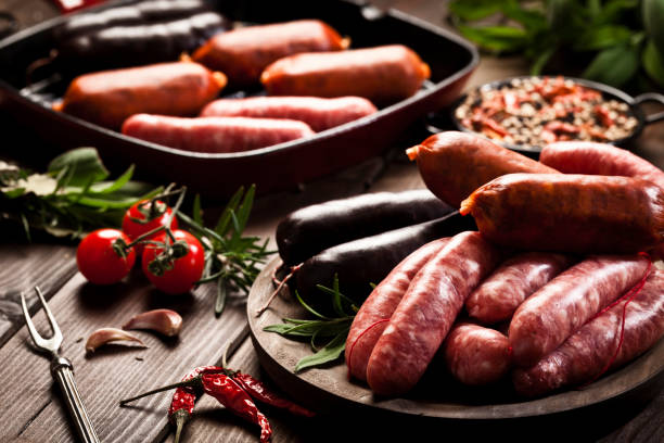 istock Sausages variation on dark wood table 641559874