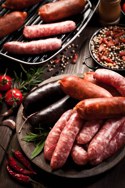 istock Sausages variation on dark wood table 641559882