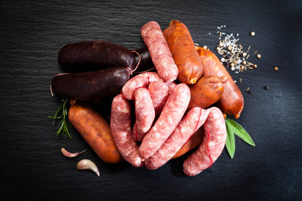 istock Sausages variation on dark wood table 641559884