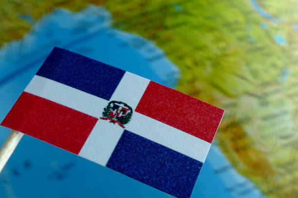 Dominican Republic flag with a globe map as a background macro