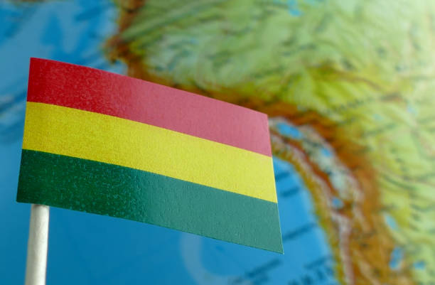 istock Bolivian flag with a globe map as a background macro 641562622