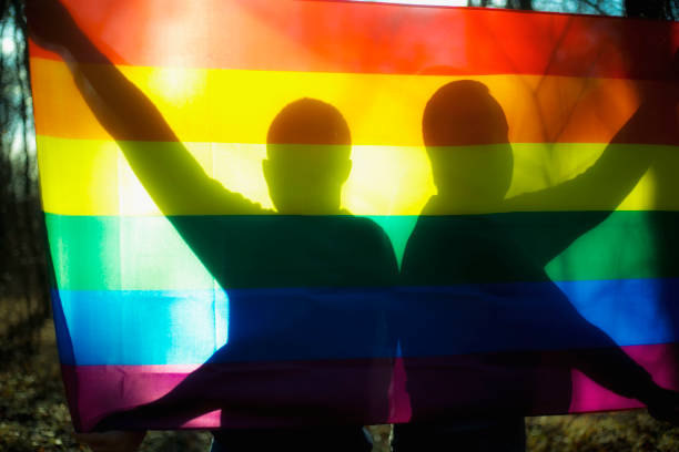 Homosexual couple and rainbow flag