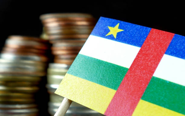 istock Central African Republic flag waving with stack of money coins 641571988
