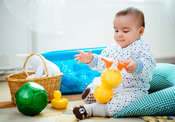 istock Baby playing with toys 641573090