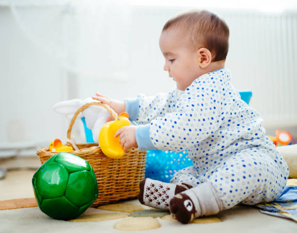 istock Baby playing with toys 641573094