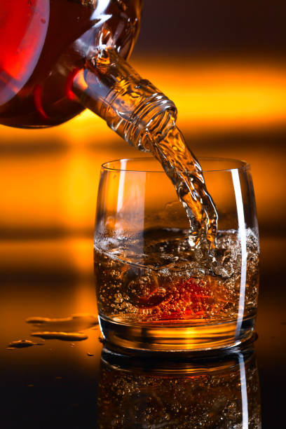istock Glass of whiskey with ice 641573652