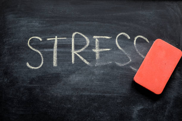erasing stress, hand written word on blackboard being erased concept erasing stress, hand written word on blackboard being erased concept board eraser photos stock pictures, royalty-free photos & images