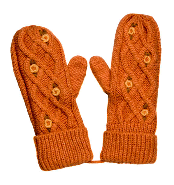 istock Mittens isolated on white background. Knitted mittens. Mittens top view.ginger mittens with pattern . 641576004