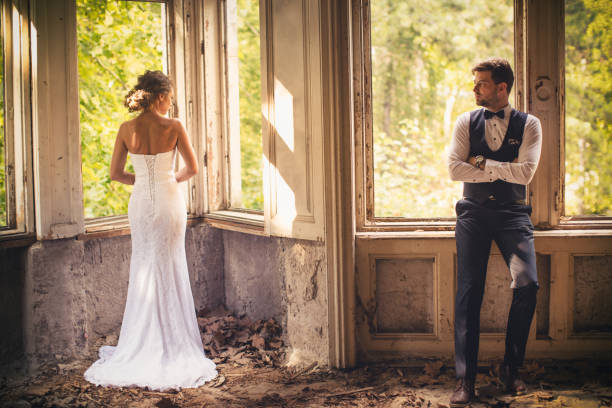 Young wedding couple posing outdoors