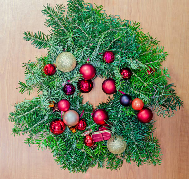 istock Round crown Christmas pine tree with globe ornaments close up 641581428