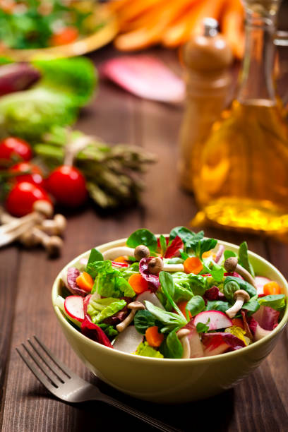 istock Healthy salad bowl on rustic wood table 641582060