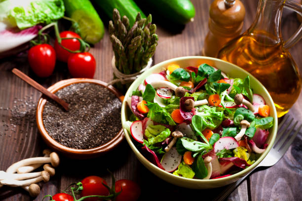 istock Preparing healthy salad with chia seeds on rustic wood table 641582070
