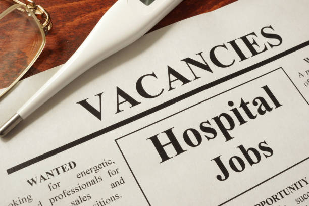 istock Newspaper with ads hospital jobs vacancy. 641582936