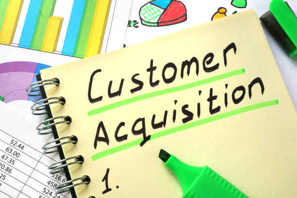 istock Notebook with  sign customer acquisition and charts. 641583014