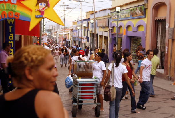 people in a shopping street in the city of Valencia in the west of Venezuela.