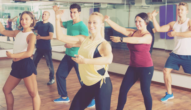 istock Men and ladies dancing zumba 641588444