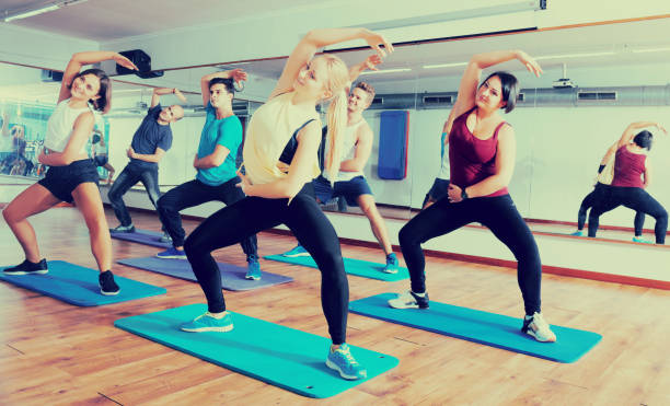 istock People relaxing and enjoying yoga 641589022
