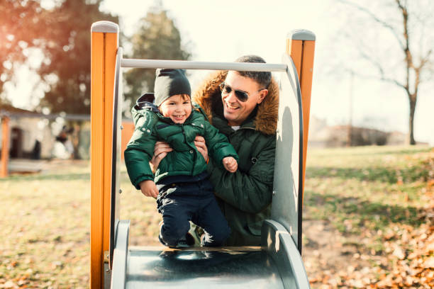 istock Father And His Son In The Park Playing 641589452