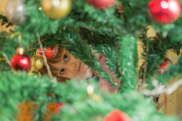 istock Cute little girl decorating christmas tree 641592766