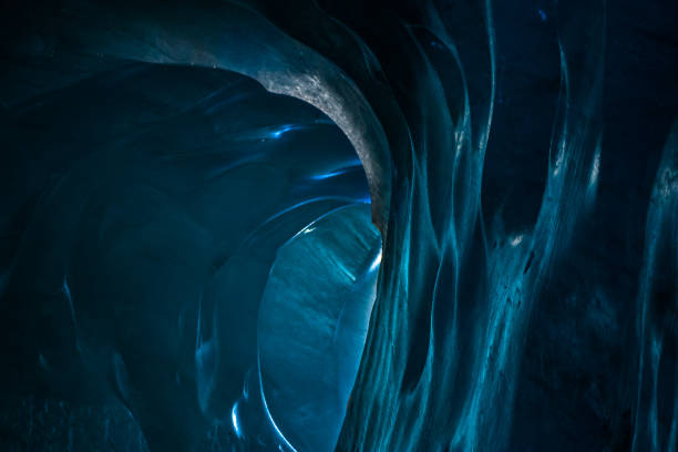 istock Entrance exit path of a glacier tunnel with solid ice walls and ceiling. 641593534