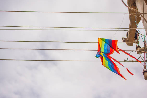 Colorful kite is flying and rain clouds in dramatic sky, Greece.