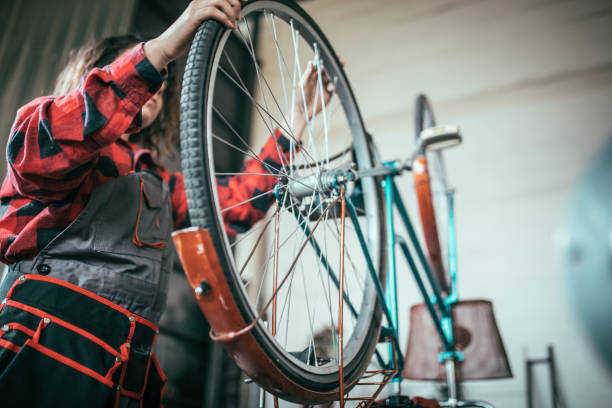 istock Girl repairs a bicycle 641595832