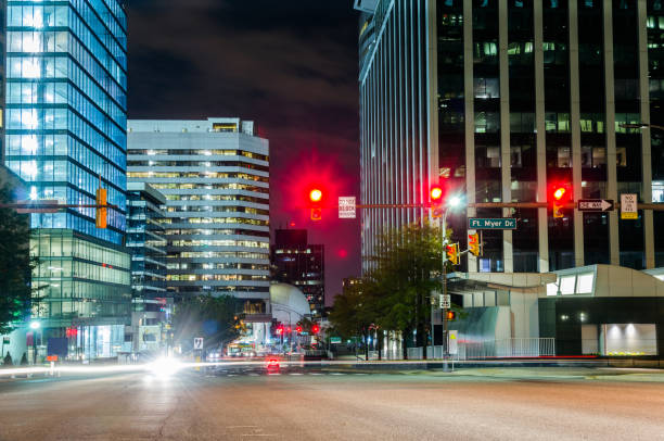 istock Crossroads with Traffic Lights at Night 641596400
