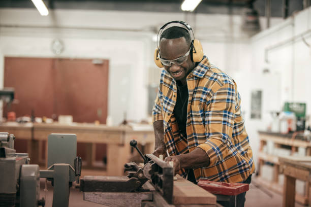 istock Male carpenter working with power tools in his wood shop 641599712