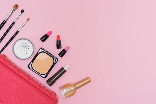 istock Makeup cosmetics palette and brushes on pink background flat lay 641599718