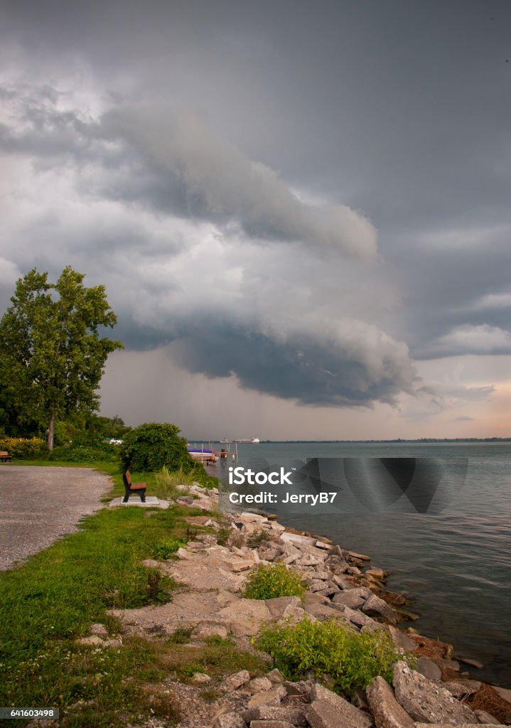 Rocky Shore Cloud Scape Storm clouds over Detroit River Shoreline Lake Erie Stock Photo