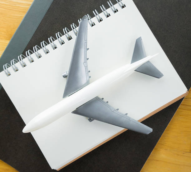 istock Travel Blogger journal book with aeroplane concept 641605964