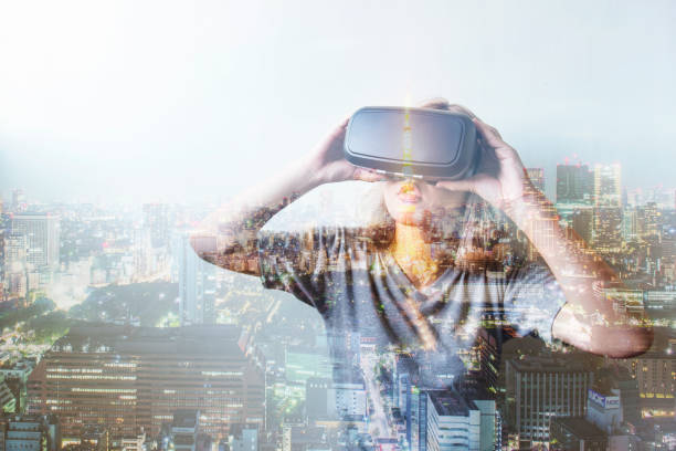 istock Double exposure of woman using the virtual reality headset 641612828