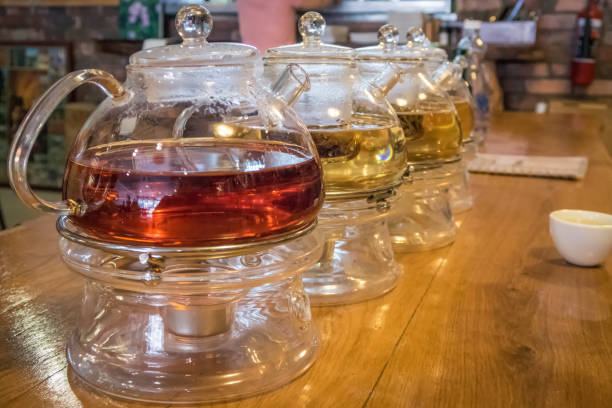 istock Glass tea pot in a cafe on a wooden table 641617102