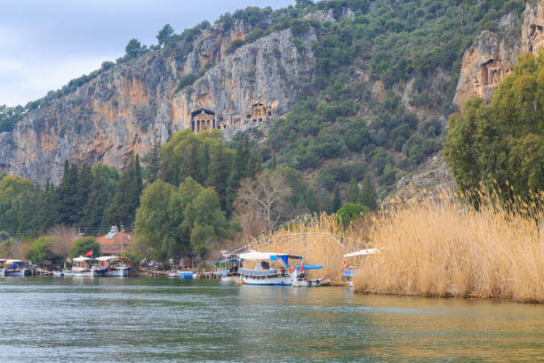 istock Dalyan river with boats and king's tombs. 641618702