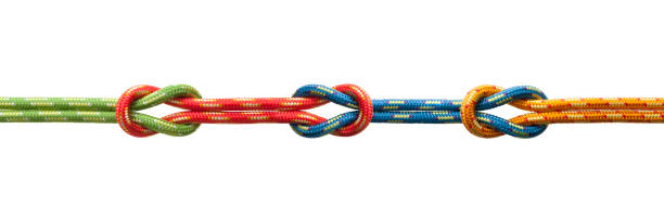 Three knots Three knots with four ropes of different colors. The ropes are red, blue, yellow and green in color. climbing equipment stock pictures, royalty-free photos & images