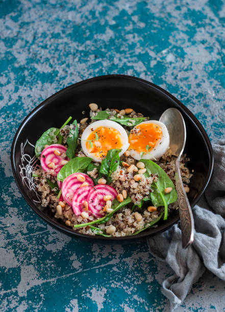 istock Healthy diet food - salad with quinoa, spinach, beets and boiled egg. 641620260