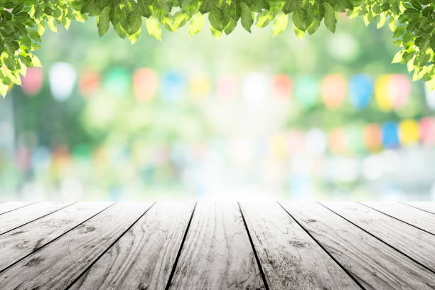 istock Empty wooden table with party in garden background blurred. 641621946