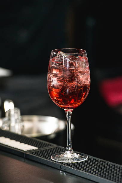 istock bartender making refreshing pink coctail with a rose on top isol 641621970