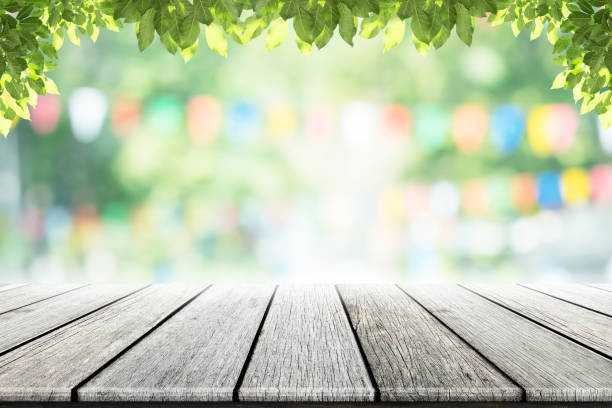 istock Empty wooden table with party in garden background blurred. 641622094